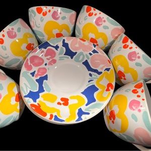 Set of colorful cups and saucers